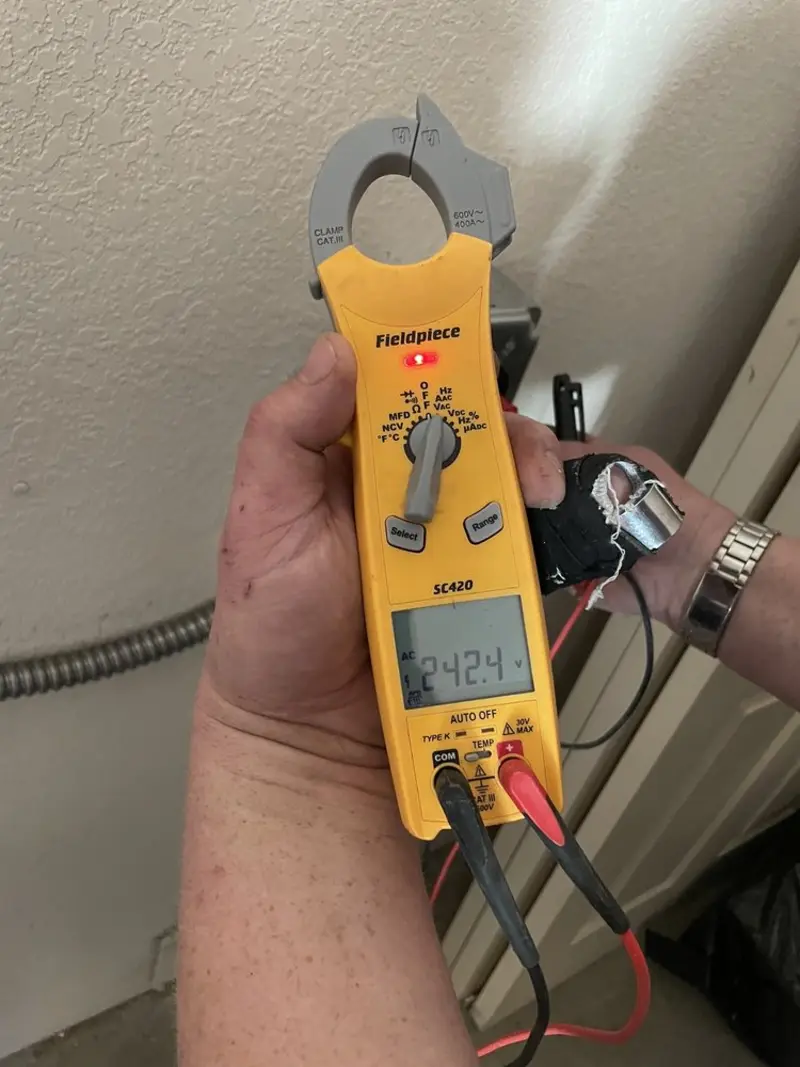 Voltage testing with clamp meter during Outlet Installation in Dogtown